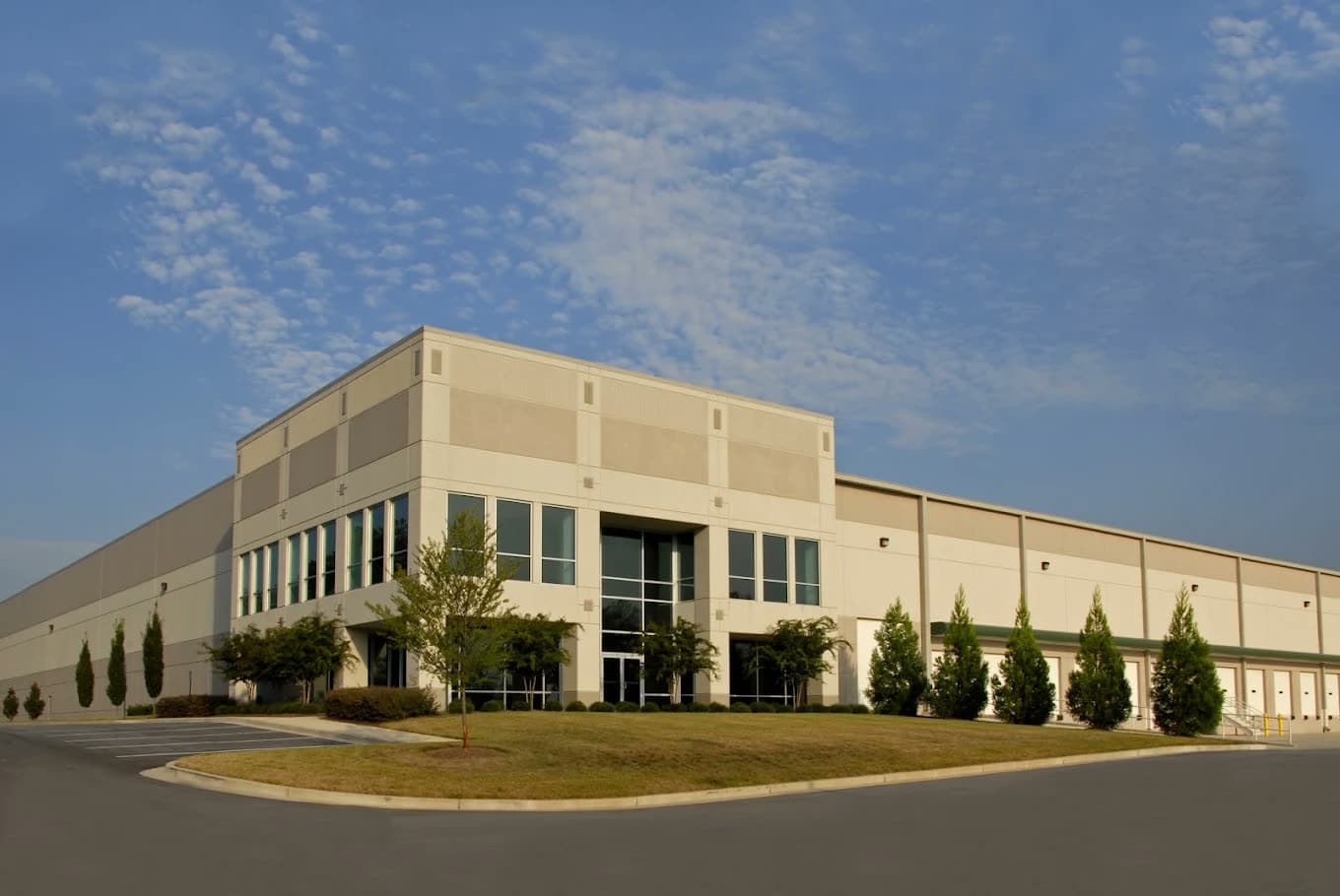 Exterior of a large distribution center with loading docks along the side